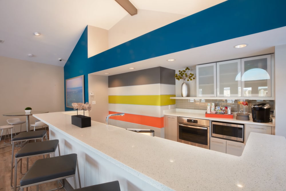 Sleek community kitchen with bar seating at Lakeside Terraces in Sterling Heights, Michigan